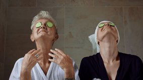 Happy senior mother in bathrobe with adult daughter indoors at home, selfcare concept. - Powered by Shutterstock - Get 15% off with code: PIKWIZARD15
