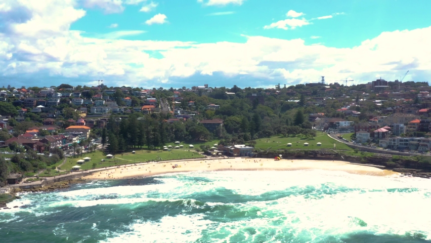 Aerial drone view of iconic Bronte Beach coastline in Sydney, Australia during summer on a sunny day 