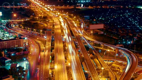 Road traffic transportation timelapse. Road and Roundabout, multilevel junction motorway, multiple roads in city, vehicular intersection, expressway with important infrastructure time lapse.