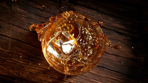 Super Slow Motion Shot of Ice Cube Falling into Whiskey at 1000fps.