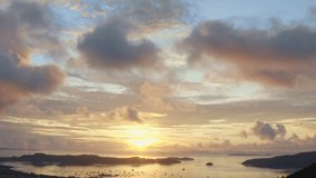 aerial view scenery sun shines through the sky over Chalong gulf.
4K video of Majestic sunrise landscape Amazing light of nature cloudscape sky above the ocean.
colorful sky sunrise background.