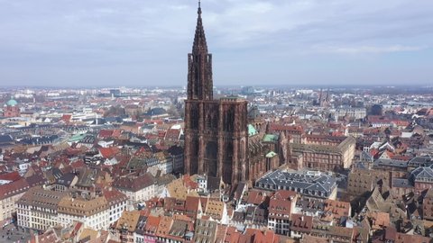 France, Strasbourg, European capital with Council of Europe and European Parliament. Drone aerial view of the famous red stone gothic Notre-Dame cathedral. German border on the back.