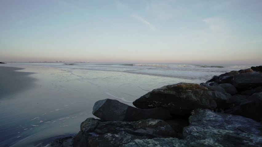 Waves rolling at blue hour on a beach in Atlantic city, New Jersey