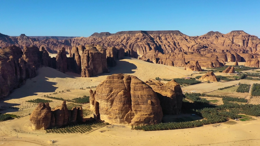 Aerial view overlooking rock formations in Al Ula, Saudi Arabia - pull back, drone shot