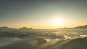 Hyper lapse video 4k motion, Aerial view Beautiful of morning scenery Golden light sunrise And the mist flows on high mountains. Pang Puai, Mae Moh, Lampang, Thailand.	