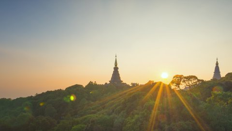 Time Lapse 4K of Twilight Moments sunset or sunrise Above the sacred pagoda at Doi Inthanon National Park, Chiang Mai, Thailand.