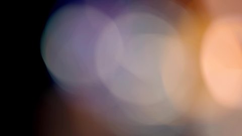 Multicolored light leaks 4k footage on black background. Lens studio flare leak burst overlays. Natural lighting lamp rays bokeh effect. For compositing over your footage, stylizing video, transitions