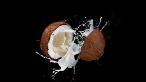 Cracked coconut with splashing milk, super slow motion filmed on high speed cinematic camera at 1000 fps. - Powered by Shutterstock - Get 15% off with code: PIKWIZARD15
