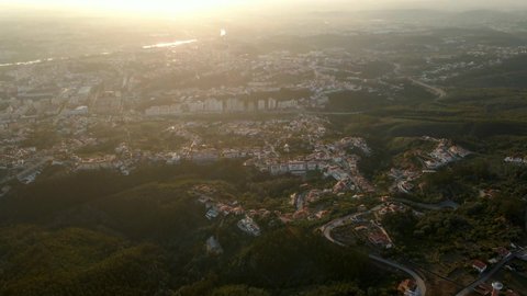 Aerial view of the city of Coimbra, Portugal, during sunset.