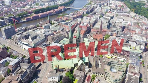 Inscription on video. Bremen, Germany. The historic part of Bremen, the old town. Bremen Cathedral ( St. Petri Dom Bremen ). View in flight. On the mechanical display, Aerial View, Point of interest