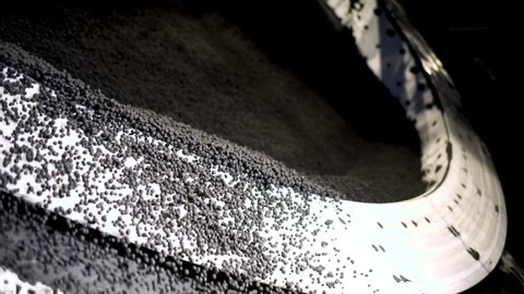 Production of iron ore pellets in pelletizer bowls. Part of the technological process for the processing of minerals. Raw material for metallurgy.