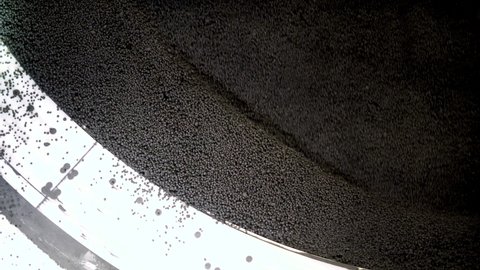 Production of iron ore pellets in pelletizer bowls. Part of the technological process for the processing of minerals. Raw material for metallurgy.