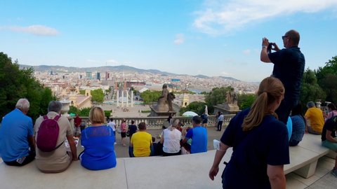 Barcelona Spain 09.25.2021
National Art Museum of Catalonia in Barcelona. Locals rest near the museum. Montjuic mountain in the capital of Catalonia Barcelona. People are sitting on the steps