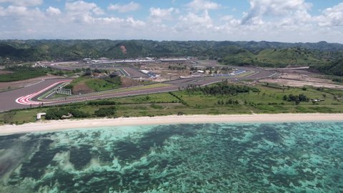 Lombok Indonesia 17 March 2022 : Pertamina Mandalika International Street Circuit in Lombok Indonesia with clear blu sky and beach background