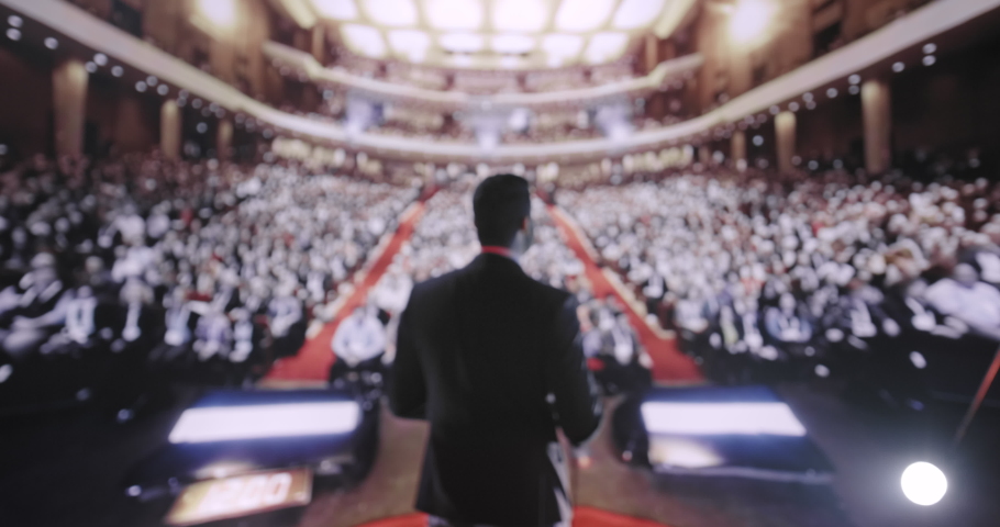 Young Political Tech Mogul Speaking at Large Crowd Business Corporate Conference Applause Success Charisma Financial CEO UHD 4K Royalty-Free Stock Footage #1088301361