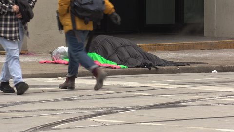 Toronto, Ontario, Canada March 2022 Homeless people in tents sleep on cold Toronto streets financial district