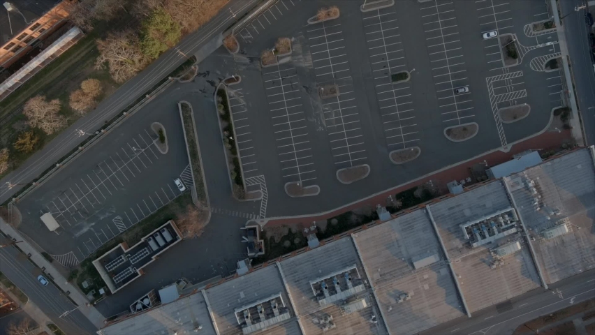 Aerial top-down view over parking of shopping center of Durham downtown in North Carolina. USA
