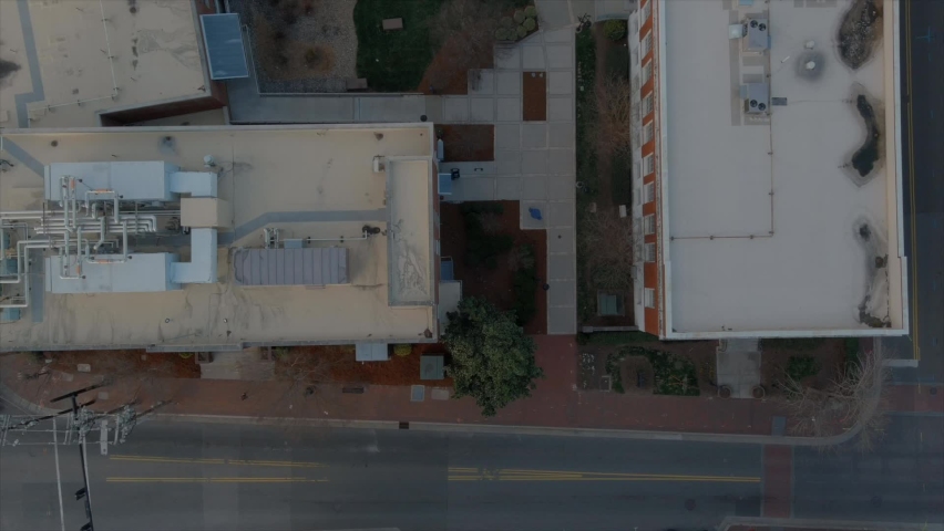 Aerial top-down view over buildings rooftops of Durham downtown in North Carolina. USA