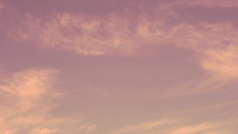 Time Lapse Clear Pink Blue Skies Light Feathery Clouds in Beautiful Pink Sunset. Light Clouds in Pink Blue Sky. Fresh Air, Clean Atmosphere, Nitrogen Layer. Background of Sky Clouds.
