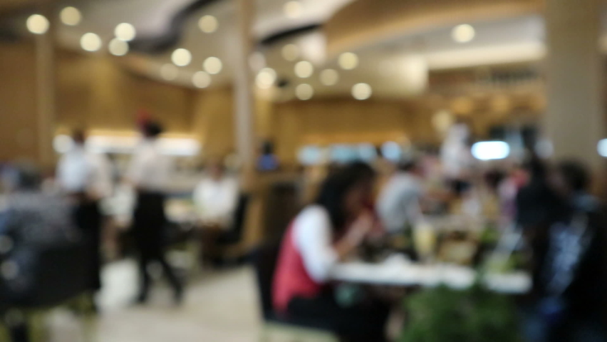 Blurred, People eating and drinking in restaurant in Mall Bangkok, Thailand