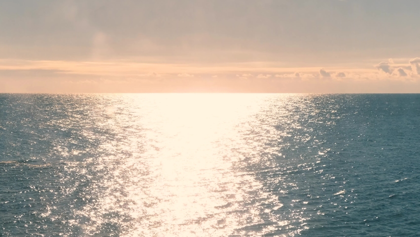 Black Sea. Sea horizon. Sunlight is reflected in the water. Calm sea on a sunny day in Odessa, Ukraine. Cinematic view. 4k, slow motion