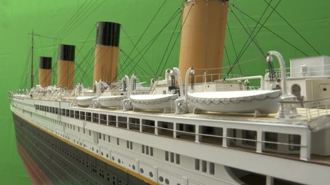Green screen with famous RMS Titanic model ship for chroma key. View of the lifeboats on the boat deck before sinking. 4k raw footage for movie.