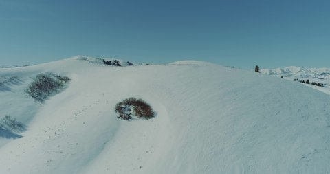 Snowy Idaho mountains aerial 4k footage on a sunny winter day