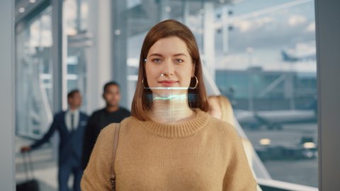 Beautiful Female Proceeds Through Automated Passport Border Control with Identity Face Recognition Scanner at International Airport. Footage Showing Biometric Facial Recognition Scanning Process.