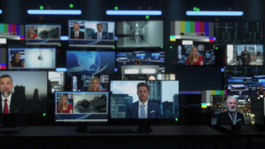 Background with Technological Multi-Screen Wall with TV Sets and Computer Displays Playing Different News Channels, Reporting on Different Topics. Playback Concept with Soft Focus Image. Royalty-Free Stock Footage #1088317915