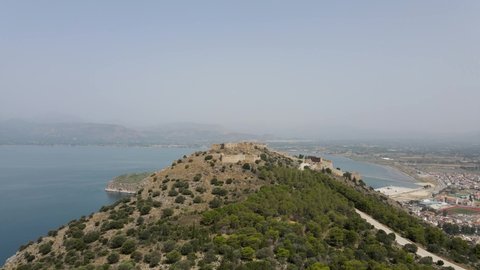 Aerial drone video of historic seaside old town of Nafplio, Argolida, Peloponnese, Greece. Sunny summer day