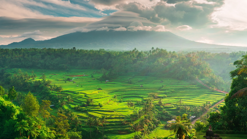 Foggy landscape tropical rain forest jungle island Bali on background majestic volcano Gunung Agung or Mount Agung, located in the district of Karangasem. 4K Aerial view | Shutterstock HD Video #1088324101