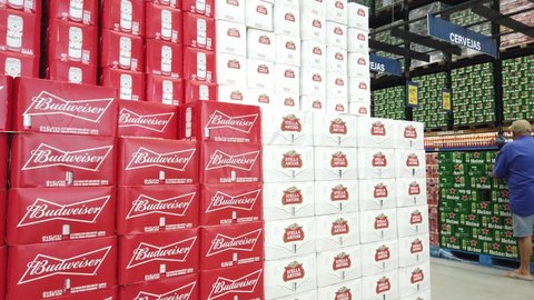 Teresopolis, RJ, Brazil - March 15th 2022 - Beers for sale at a retailer. Budweiser cans boxes, Stella Artois, Heineken and Brahma beers. Big shelves with beverages in a large market. Wholesale.