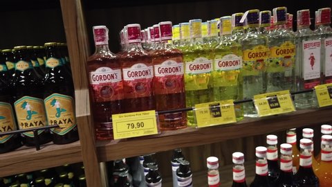 Teresopolis, RJ, Brazil - March 15th 2022 - Gordon's and Beefeater gin bottles. Red, yellow and traditional bottles. Beverages, alcoholic drinks at a market shelf. 