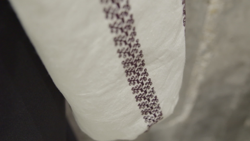 macro filmed details from a traditional hand - embroidered peasant blouse - ie Romanian Royalty-Free Stock Footage #1088327103