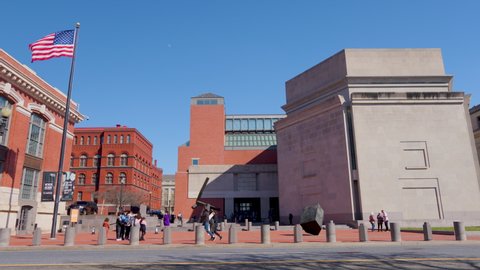 Washington, DC - USA - March 11 2022: The United States Holocaust Memorial Museum (USHMM) seen  on a sunny winter day from Raoul Wallenberg Place (15th St.) The camera makes a tilt-up motion. 
