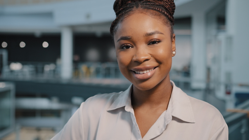 African american smiling businesswoman professional specialist student teacher manager female lawyer woman smile face looking camera posing at corporate company office happy millennial girl portrait Royalty-Free Stock Footage #1088336973