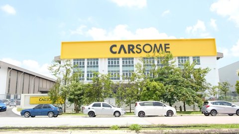  Shah Alam, Malaysia- Circa February, 2022: A handheld panning footage of Carsome Certified lab building. A refurbishment center for second hand car. 