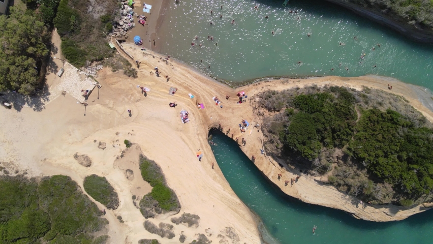 Aerial top-down view of crowded beach at Canal d' Amour on Corfu, Greece