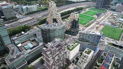 Amsterdam , Netherlands - 01 04 2022: Aerial Pan Flying Over Amsterdam Zuidas Financial District Past The Valley Flat Complex
