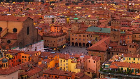 Bologna, Italy. Aerial view of Bologna, Italy at sunset. Colorful sky over the historical city center with car traffic and old buildings. Time-lapse