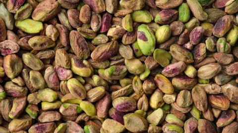 Pistachios without shell top view rotation. Pistachio nuts. Whole nut kernels