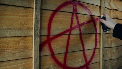 Anarchy Symbol Spray Painted On Wood Fence