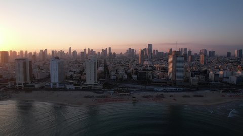 Tel Aviv, Israel - July 7, 2021: Aerial footage of the Tel Aviv skyline at dawn.