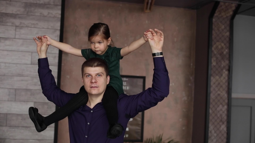 Happy family on the New Year holiday. Mom, Dad. son, daughter are celebrating at home.