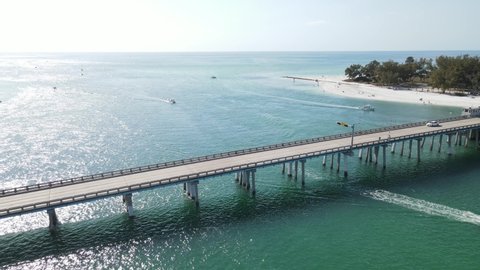 aerial spinning to the north and Coquina Beach and park from Longboat Pass in Sarasota, Florida
