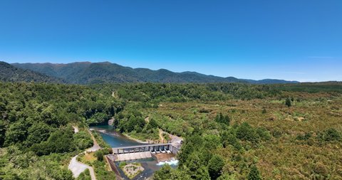 Flight above Kaimanawa hydro scheme and native forests on perfect day - NZ