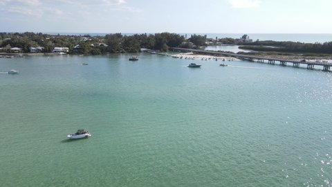 aerial of groups of boaters line the shores at Longboat Pass in Sarasota, Florida