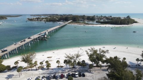 gorgeous orbiting aerial of the boating activity near Longboat Pass and Jewfish Key in Sarasota, Florida