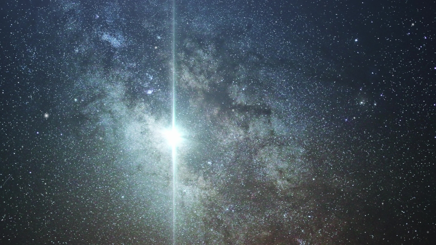 vertical bright light with milky way background