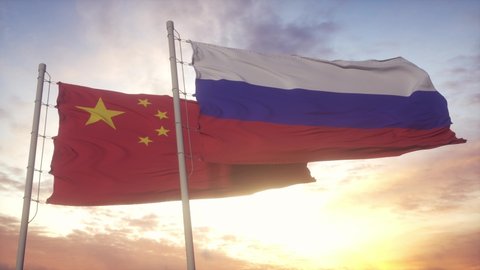 Russia and China flag on flagpole. Russia and China waving flag in wind. Russia and China diplomatic concept